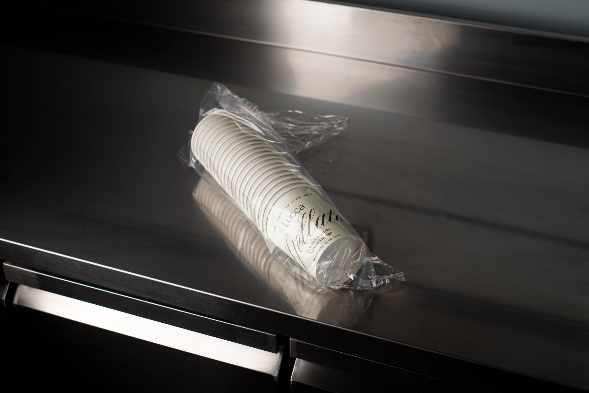 Packaged Ice Cream Cups on Stainless Steel Surface Mockup