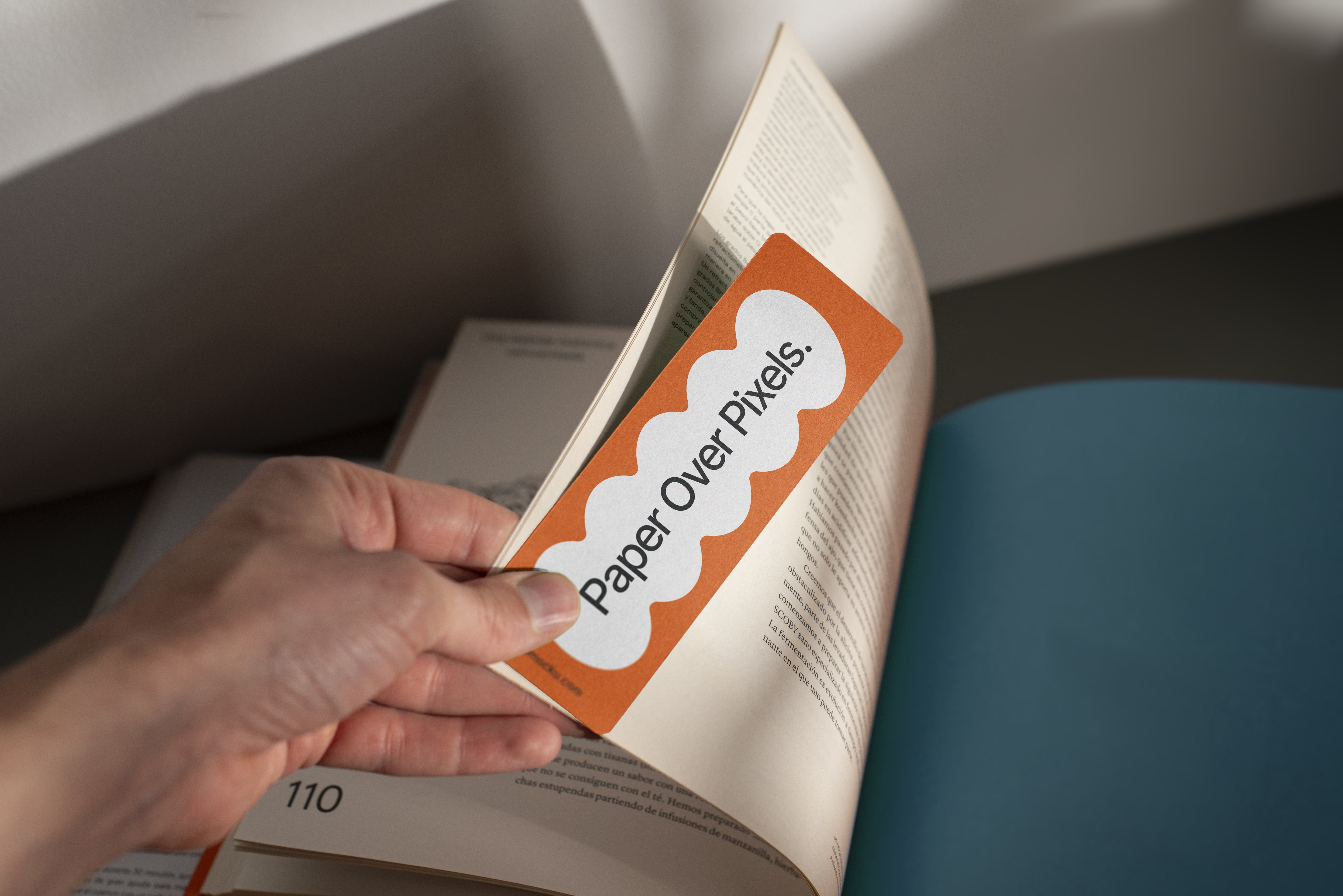 Hand Holding Bookmark Mockup