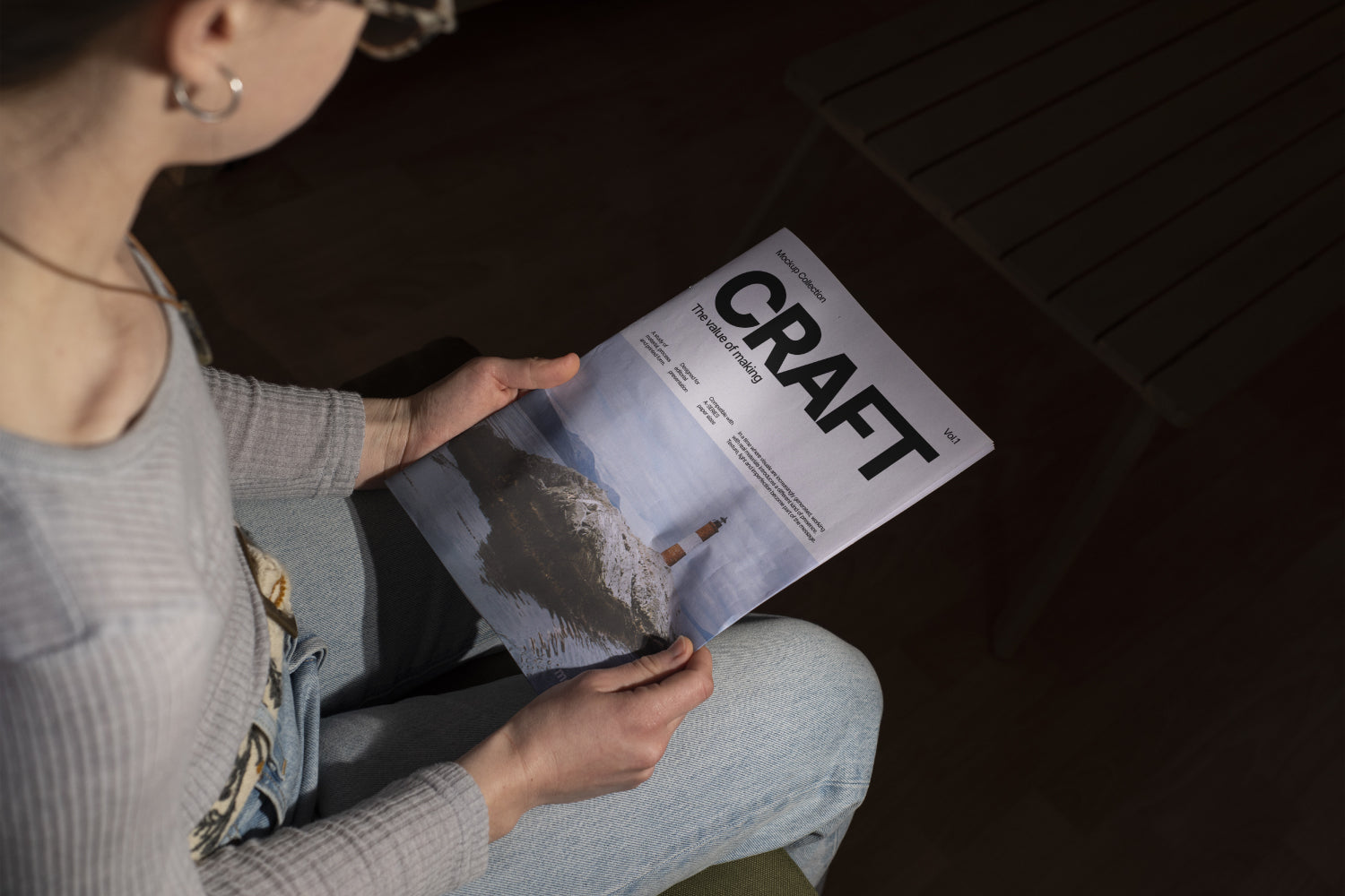 Holding Newsprint Magazine Mockup